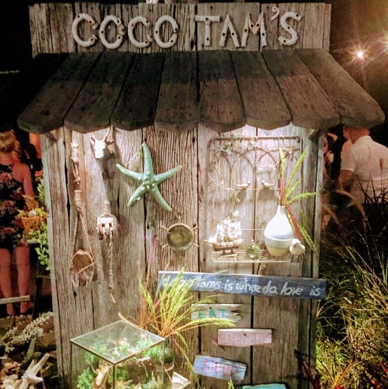 Coco Tam's beach bar in Koh Samui, Thailand, showcasing nautical decorations and a vibrant outdoor setting.