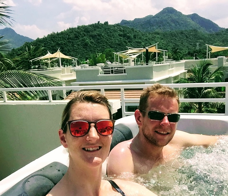 Rooftop jacuzzi at Oriental Beach Pearl Resort in Sam Roi Yot, Thailand, with guests enjoying the scenic mountain views and tropical surroundings.