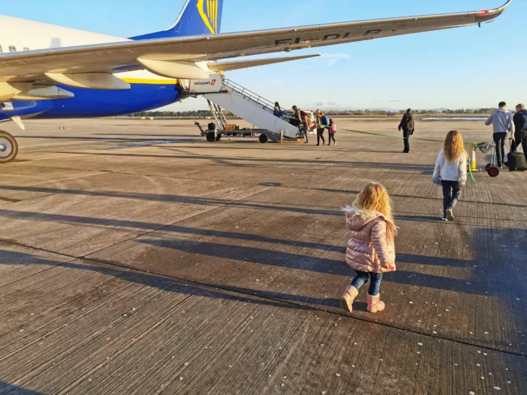Our two girls walking to get on the airplane.
